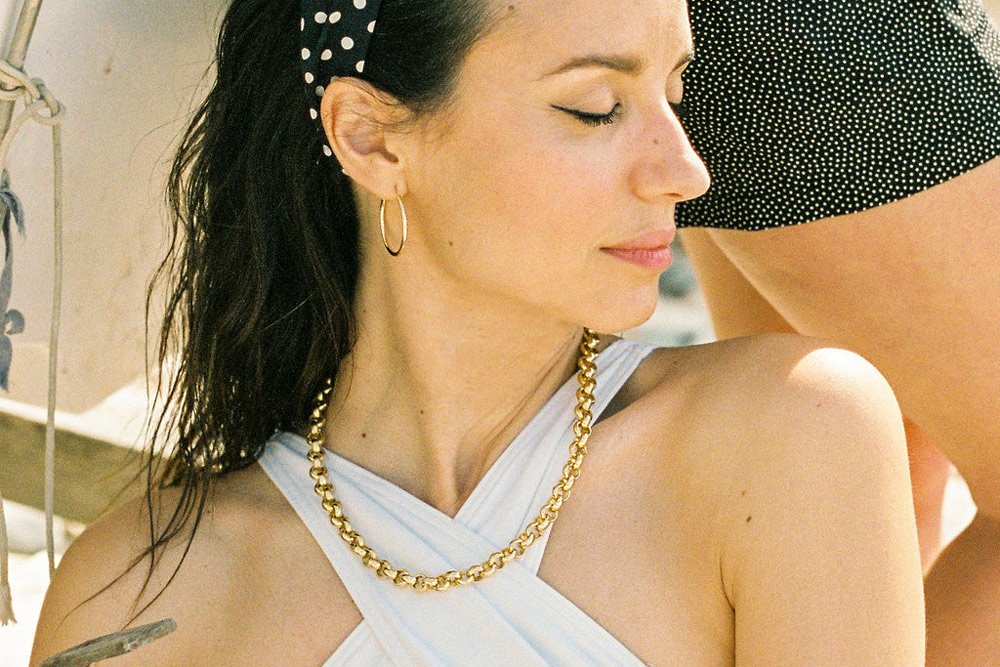bling necklace and sleek medium creole earrings model