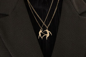 joy and hug necklaces model