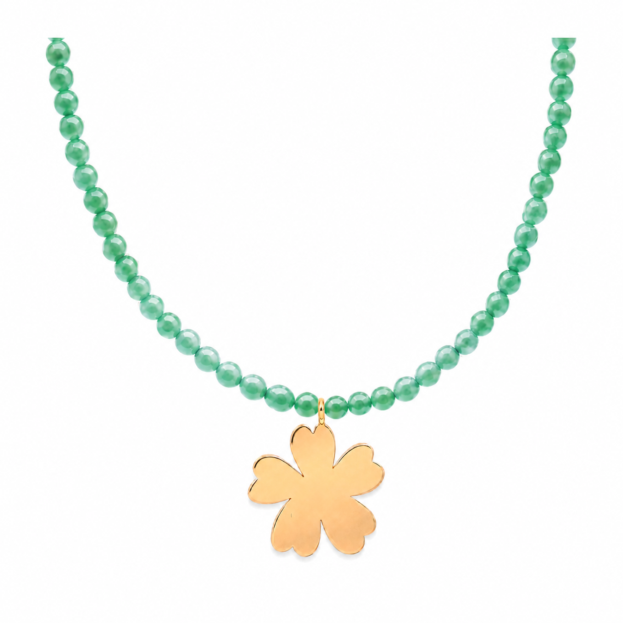 Close-up of green jade beads and gold Fleur flower pendant